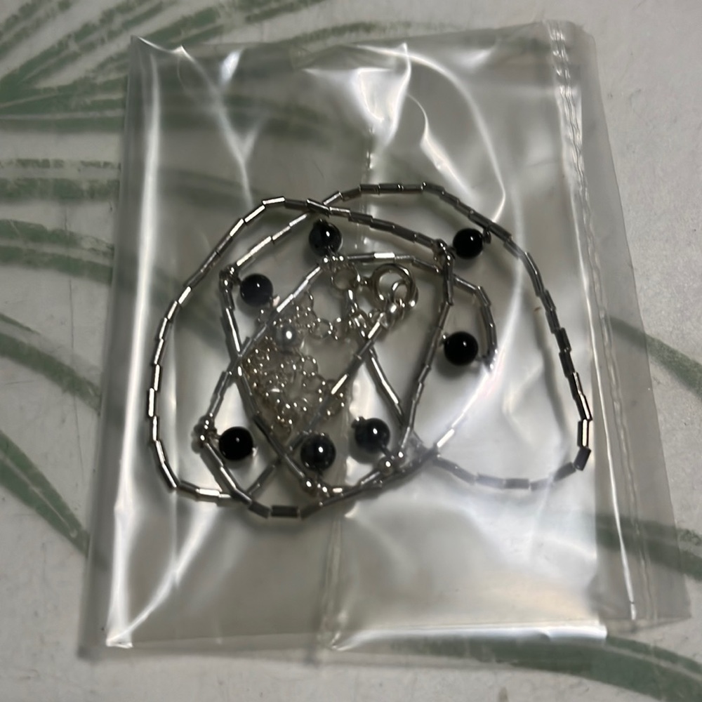 Sterling silver genuine onyx and hematite drop necklace.